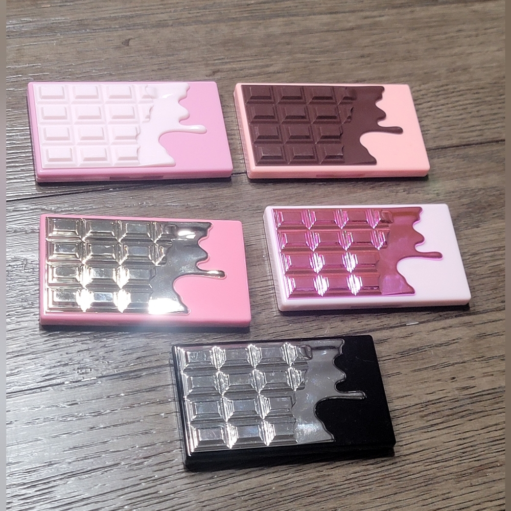 Revolution makeup mini eyeshadow palettes and blush/highlighter duo.